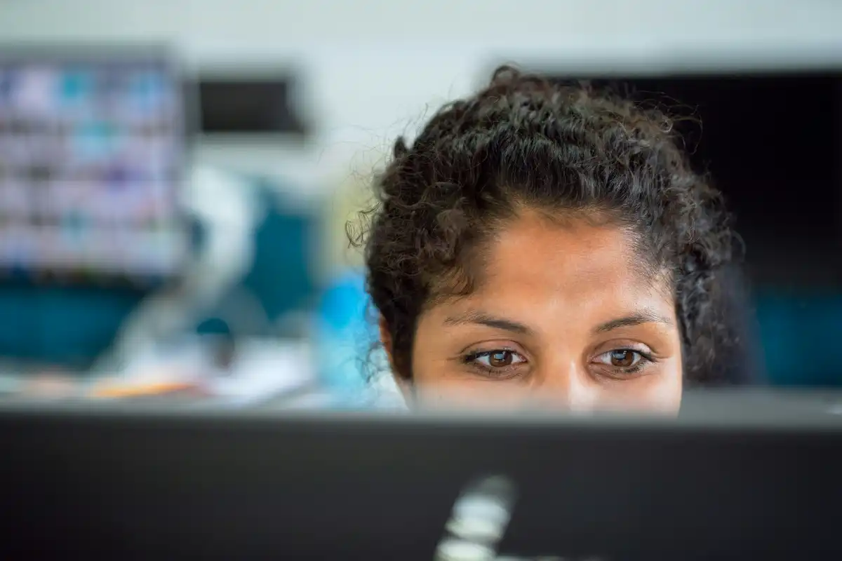 Close up of a woman's eyes looking at screen